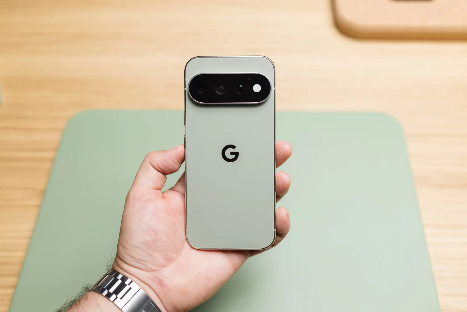 Pixel 10 Pro held in one hand